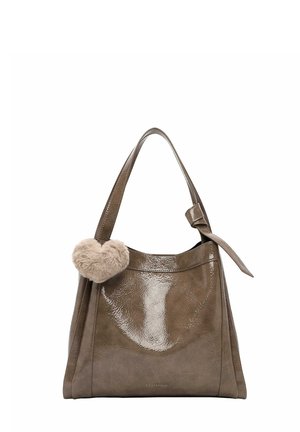 Glossy taupe handbag with a loop handle, featuring a soft beige heart-shaped pom-pom charm hanging on the side.
