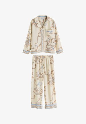 Kermanvärinen pyjamasetti, jossa on sinisten ja ruskeiden mustekalojen kuvio. Ylössä on kaulus, tasku ja napitus; housuissa on kuminauhavyötärö.