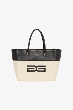 Tote bag with a cream canvas body and black leather accents. Features dual handles and a prominent black logo on the front.