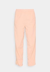 Kalhoty z lehké, bavlněné tkaniny v broskvové barvě, s elastickým pasem, zúženými nohavicemi a jemnou strukturou po celém povrchu.