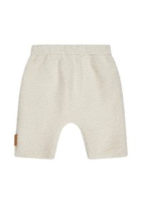Cream-colored shorts made of soft, textured fabric. Features an elastic waistband and a small brown label on the side.