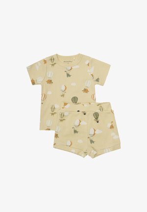 Pyjama jaune à manches courtes et à rayures, présentant des motifs de dinosaures et de montgolfières, avec un short assorti et une taille élastique.