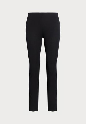 Black trousers made from stretch fabric, featuring a slim fit and an elastic waistband. No visible patterns or hardware.