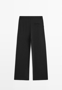 Wide-leg black trousers made of smooth fabric, featuring a back pocket with a button closure and a tailored waistband.