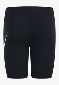 Navy blue cycling shorts made of stretchy fabric, featuring a white logo design on the left side and a smooth, fitted silhouette.