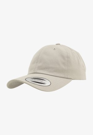 Beige cotton cap with a curved brim, six ventilation holes, and a classic logo patch on the front. Smooth texture and casual design.