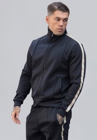 Verryttelytakki - black