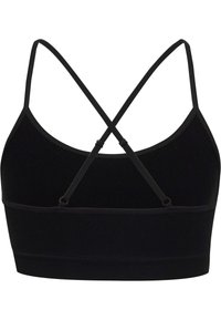 Zwarte geribbelde bralette met verstelbare kruisbanden. Smooth textuur, getailleerd ontwerp en brede onderband voor ondersteuning.