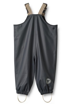 Salopette imperméable noire pour enfants avec bretelles rayées réglables et poignets élastiques avec sangles pour les pieds.