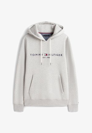 Gray hoodie made of soft fabric features a front pocket, drawstring hood, and printed "TOMMY HILFIGER EST. 1985" logo in dark blue and red.