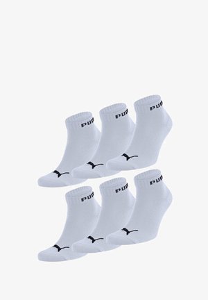 White ankle socks with black "PUMA" branding and logo on the front. Set of six pairs, cotton blend material, ribbed cuff for fit.