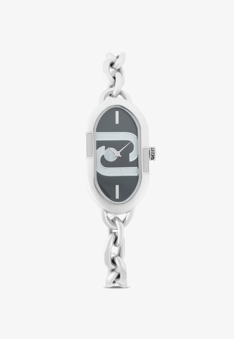 Reloj de cadena de plata con una esfera ovalada de color gris oscuro, con acentos y marcas de horas en plata. Movimiento de cuarzo visible.
