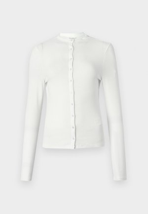 White long-sleeve ribbed cardigan with a round neckline and a row of small, matching buttons down the front. Soft texture, slim fit.