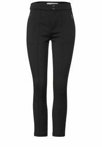 Mustat räätälöidyt housut, joissa on muotoonleikattu malli, sileä rakenne, kaksi etutaskua vetoketjulla ja kaksoispainonauhavyötärö.