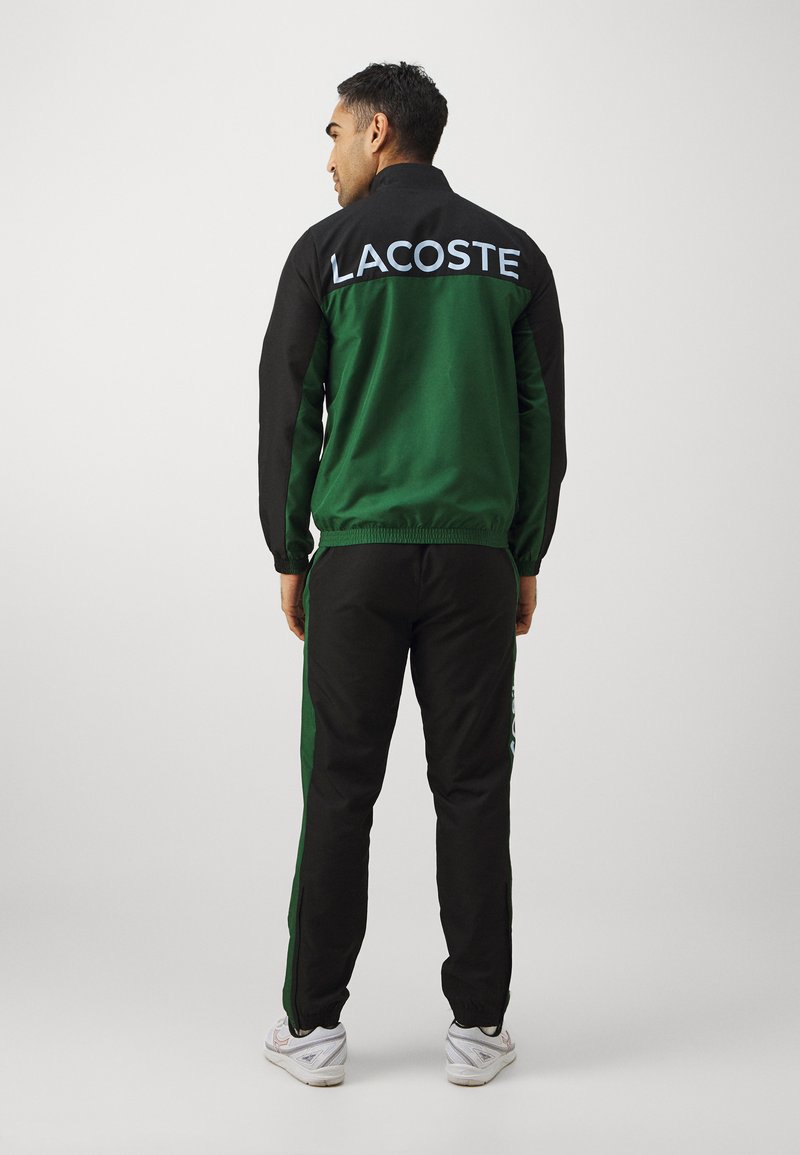 Lacoste Sport TENNIS TRACKSUIT - Trainingsanzug - green/black-rill/grün -  Zalando.ch