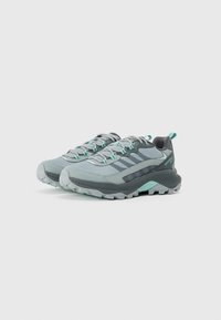 Gray hiking shoes with aqua accents, featuring a textured upper, durable rubber outsole, and a reinforced toe cap. Lightweight design with laces.