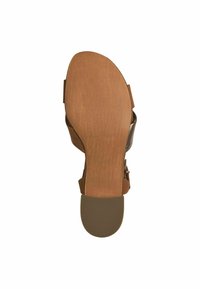 Brown heeled sandal featuring a textured footbed with a smooth finish. Includes wide straps over the top and a rounded toe design.