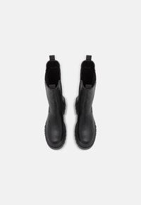 Black ankle boots with a smooth leather upper, textured side panels, and pull tabs. Chunky rubber soles provide traction and durability.