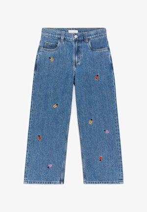 Blue denim jeans with wide legs and embroidered multicolored ladybugs scattered across the fabric.