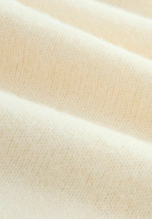Hellcremefarbener gestrickter Stoff mit weicher Textur, der ein glattes, gleichmäßiges Muster und subtile Farbvariationen aufweist.