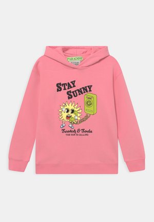 Pink hoodie with cartoon sun holding a green rotary phone, text "Stay Sunny," "Scotch & Soda," and "The sun is calling."