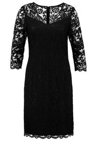 Černé krajkové šaty s třičtvrtinovými rukávy, vlnovým lemem a zipem na zadní straně. Obsahují květinový krajkový vzor po celé ploše.