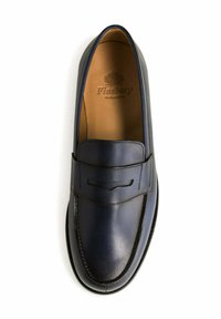 Navy leather loafer with a smooth finish, moccasin-style silhouette, subtle stitching details, and embossed logo on the insole.