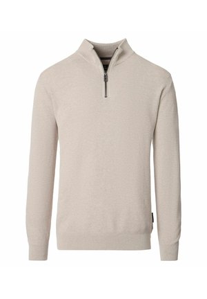 Beige strikket trøje med lange ærmer og en kvart lynlås, med ribstrikkede manchetter og kant, der har en opretstående krave og tekstureret stofmønster.