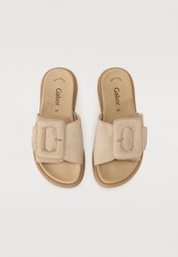 Beige suede slide sandals with a wide strap featuring a rectangular buckle. Soft footbed and rubber outsole for comfort. Size 37 marked inside.