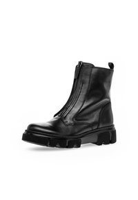 Black leather ankle boot featuring a side zipper, thick textured sole with angular accents, and a pull tab at the back for easy wear.