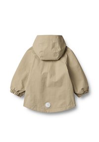 Vaalea beige kevyt takki, jossa on huppu, elastiset hihansuut ja pyöreä logo-merkki takana. Sujuva kangas ja yksinkertainen muotoilu.