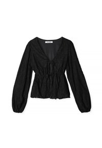 Blouse noire avec un col en V, motif floral texturé, manches longues bouffantes et cordon à la taille pour un ajustement réglable.