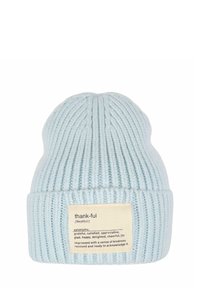 Light blue knitted beanie with vertical ribbing, featuring a beige label with the word "thank-ful" and synonyms printed in black text.