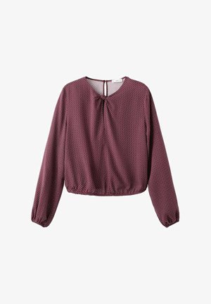 Bordo bluzica z dolgimi rokavi, ohlapen kroj, okrogla izrez, s trakom na zadnji strani in subtilnim geometrijskim vzorcem. Narejena iz lahkotnega materiala.