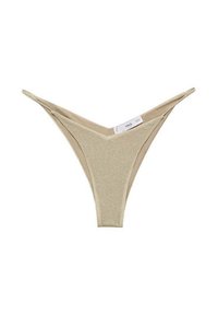 Guldglittrig tanga med V-formad framsidan och tunna sidor. Slät textur med en kontrasterande beige innerfoder. Märket synligt på sidan.