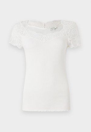 White ribbed top featuring lace short sleeves and a scalloped neckline. The fabric has a smooth texture with a fitted silhouette.