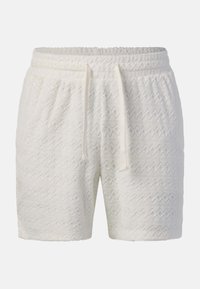 Shorts en éponge blanche texturée avec taille élastique et cordon de serrage, arborant un motif géométrique discret et des poches latérales.