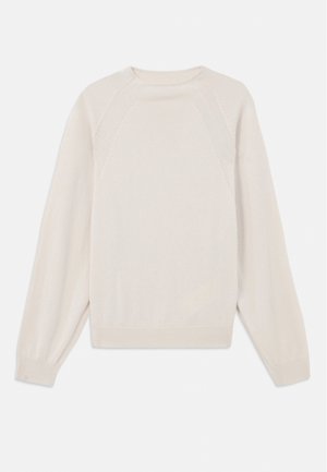Light cream sweater made of soft, knit fabric. Features a crew neck, long sleeves, and ribbed cuffs and hem with raglan sleeve design.