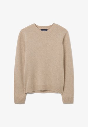 Beige trui gemaakt van zacht breimateriaal, met een ronde halslijn, geribbelde manchetten en een rechte zoom. Eenvoudig, veelzijdig ontwerp.