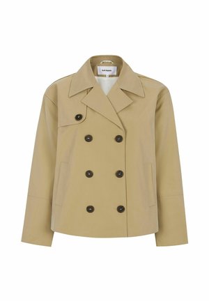 Trench-coat beige à double boutonnage avec de gros boutons noirs, large col et poches latérales. Fabriqué en tissu lisse et léger.