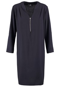 Robe à manches longues bleu marine foncé avec décolleté en V et petite fermeture éclair à l'avant, coupe droite et plis subtils en tissu aux épaules.