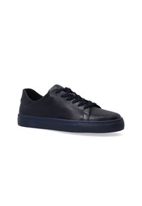 Navy blue leather sneakers with a smooth texture, rounded toe, patterned rubber sole, and matching laces. Simple, low-profile design.