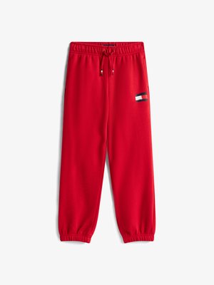 Pantaloni de trening roșii, dintr-un material moale, cu o talie elastică și șnur, mansete la glezne și un mic patch cu logo pe lateral.