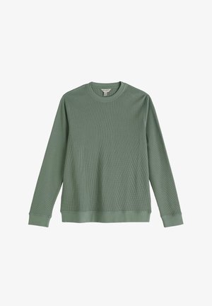 Zelena majica z dolgimi rokavi iz teksturirane rebraste tkanine. Ima okrogel izrez ter rebraste manšete in spodnji rob. Enostavna, minimalistična zasnova.
