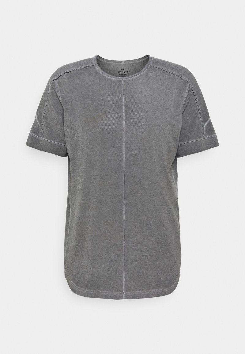 Szara koszulka Dri-FIT z okrągłym dekoltem, krótkimi rękawami, kontrastowym przeszyciem i luźnym krojem. Miękka faktura o gładkim wykończeniu.