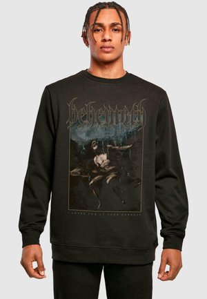 Fekete pamut pulóver, grafikával, amelyen egy figura látható, arany szöveggel, amely így szól: "Behemoth" és "A legsötétebb pillanataidban szerettelek."