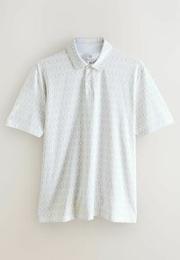 Rövidujjú pólóing fehér szövetből, geometrikus arany mintázattal. Gallérral és három gombos gombolással rendelkezik. Könnyű anyagú.