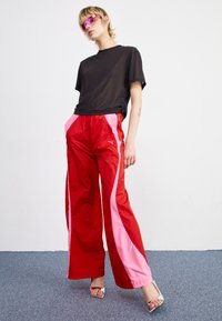 Puma DARE TO PARACHUTE PANTS - Hlače - for all time red