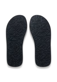 Μαύρα εσωτερικά πέλματα από καουτσούκ με ανάγλυφο γεωμετρικό σχέδιο, που παρουσιάζει διάφορες γωνίες και σχήματα, σχεδιασμένα για άνεση και υποστήριξη.