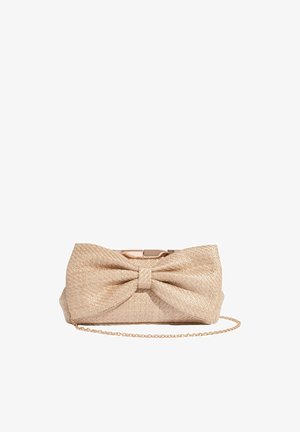 Beige woven clutch purse with a large bow detail and a thin gold chain strap on a white background.